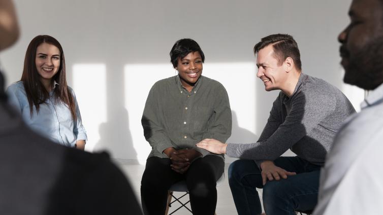 People sitting in a circle talking